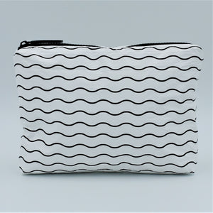 Small zip pouch in Waving pattern in black and white.