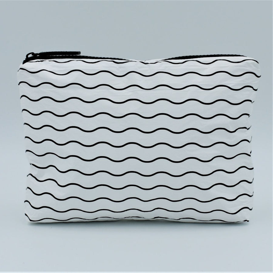 Small zip pouch in Waving pattern in black and white.