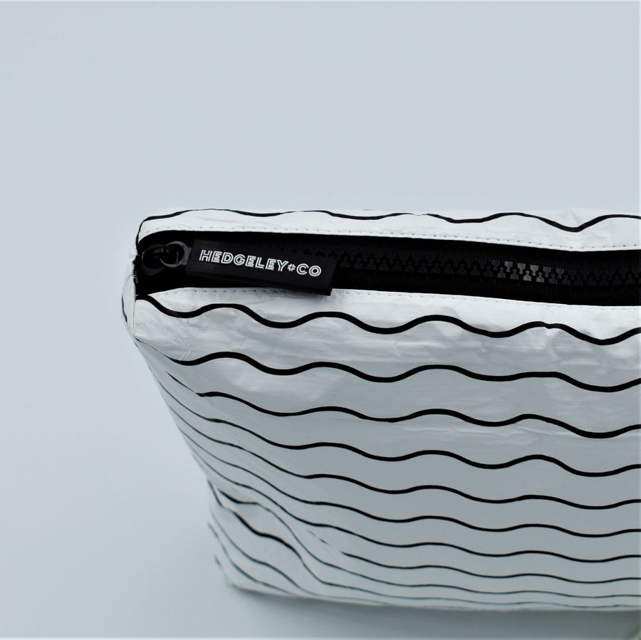 Zip detail of Small zip pouch in Waving pattern in black and white.