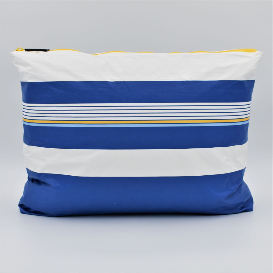 Large zip pouch in Lined Up pattern in blue, white and golden yellow.