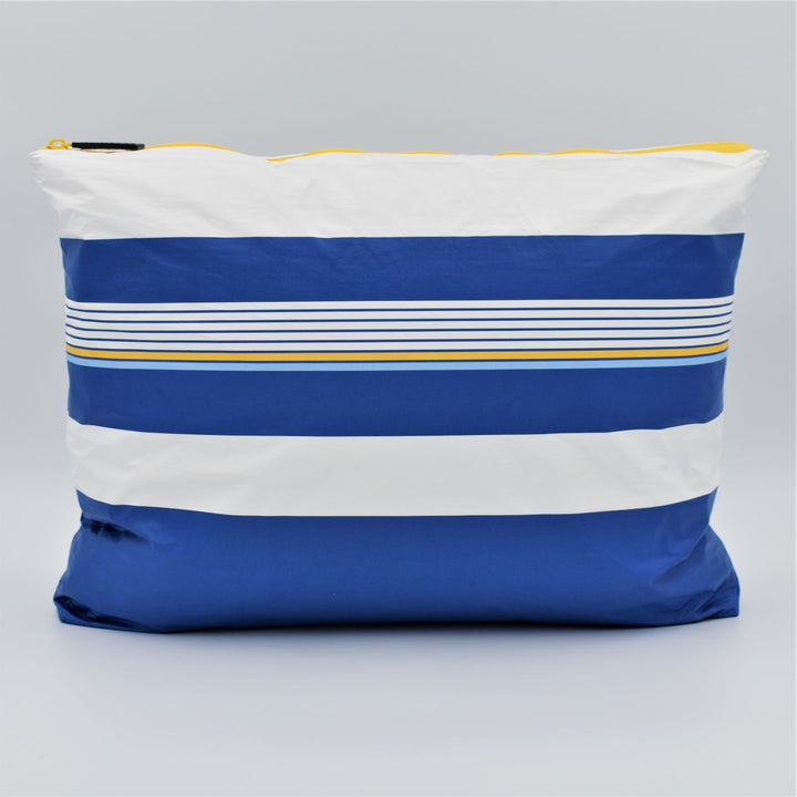 Large zip pouch in Lined Up pattern in blue, white and golden yellow.