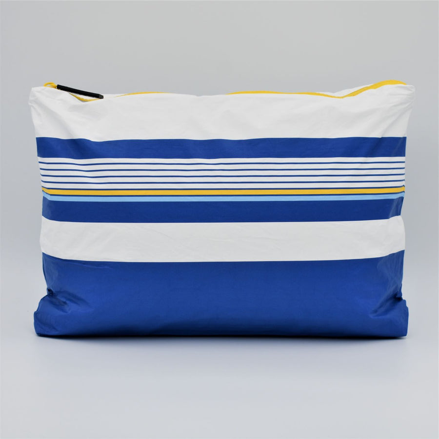 Medium zip pouch in Lined Up pattern in blue, white and golden yellow.