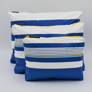 Bundle of three zip pouches in Small, Medium and Large. Lined Up pattern in blue, white and golden yellow.