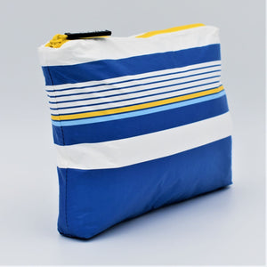 Side view of Medium zip pouch in Lined Up pattern in blue, white and golden yellow.