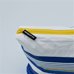 Zip detail for zip pouch in Lined Up pattern in blue, white and golden yellow.