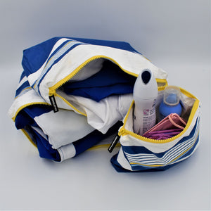 Bundle of three zip pouches in small, medium and large in Lined Up pattern in blue, white and golden yellow.