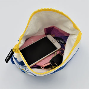 Small zip pouch in Lined Up pattern in blue, white and golden yellow.