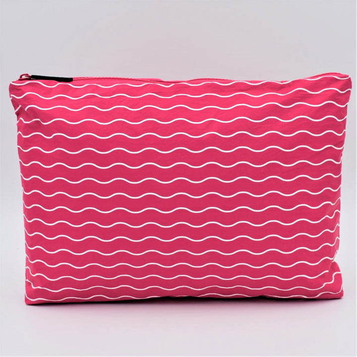 Medium zip pouch in Waving pattern in hot pink and white.