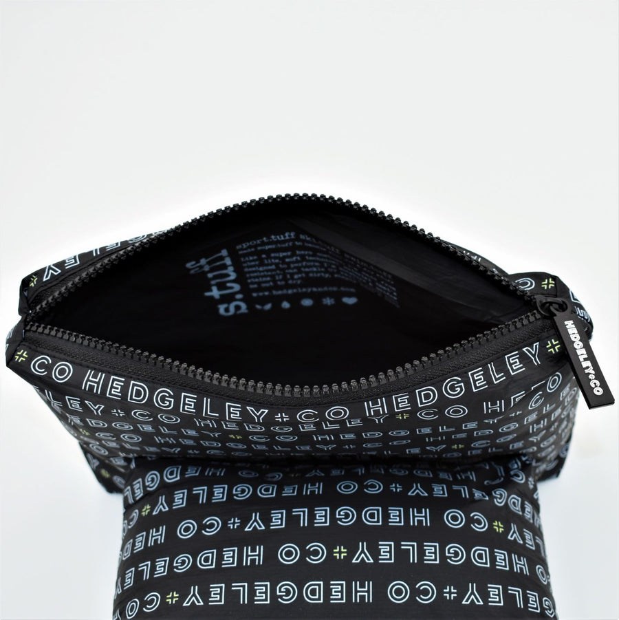 Inside view of Mini zip pouch in Just Us design in black, white and a hint of yellow.