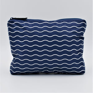 Small zip pouch in Waving pattern in navy blue and white.