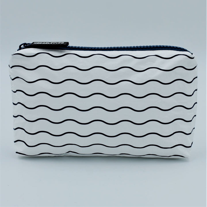 Mini zip pouch in Waving pattern in navy blue and white.