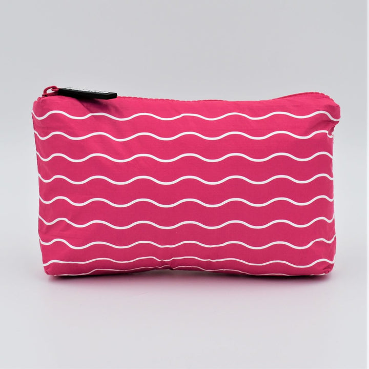 Mini zip pouch in Waving pattern in hot pink and white.