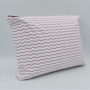 Side view of Large zip pouch in Waving pattern in hot pink and white.