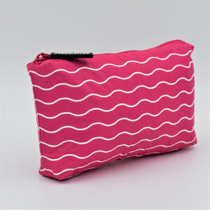 Mini zip pouch in Waving pattern in hot pink and white.