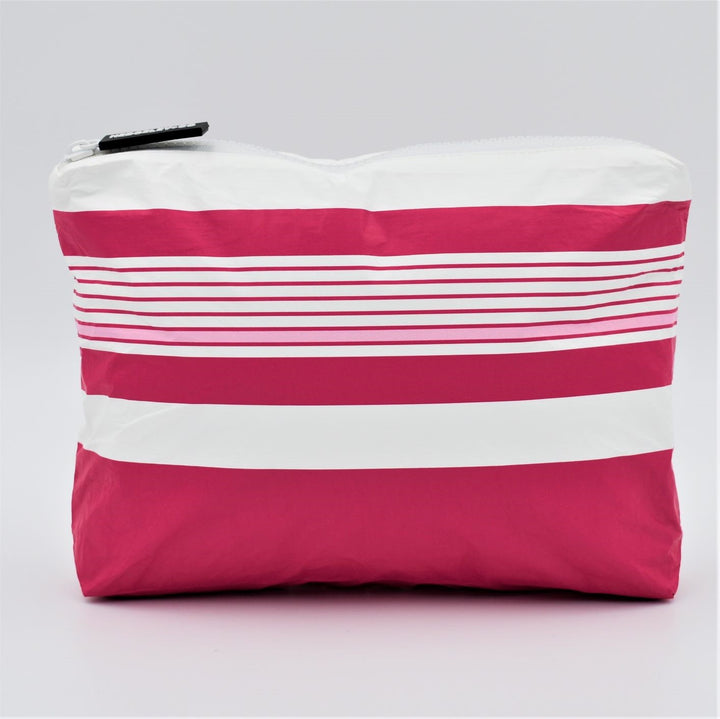 Small zip pouch in Lined Up pattern in raspberry, white and pastel pink.