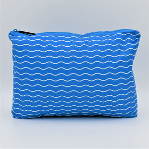 Medium zip pouch in Waving pattern in summer blue and white.