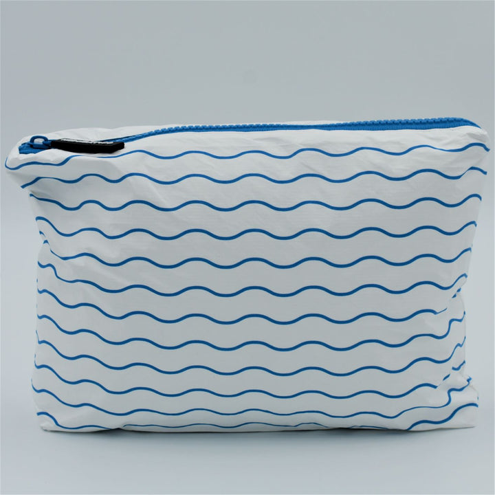 Small zip pouch in Waving pattern in summer blue and white.