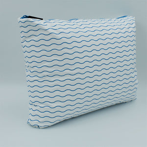 Side view of Large zip pouch in Waving pattern in summer blue and white.