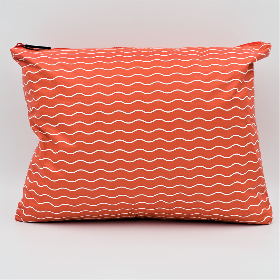 Large zip pouch in Waving pattern in tomato red and white.