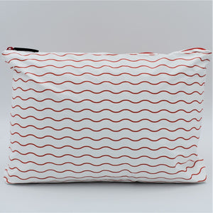 Medium zip pouch in Waving pattern in tomato red and white.