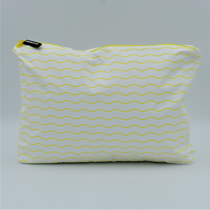 Medium zip pouch in Waving pattern in yellow and white.