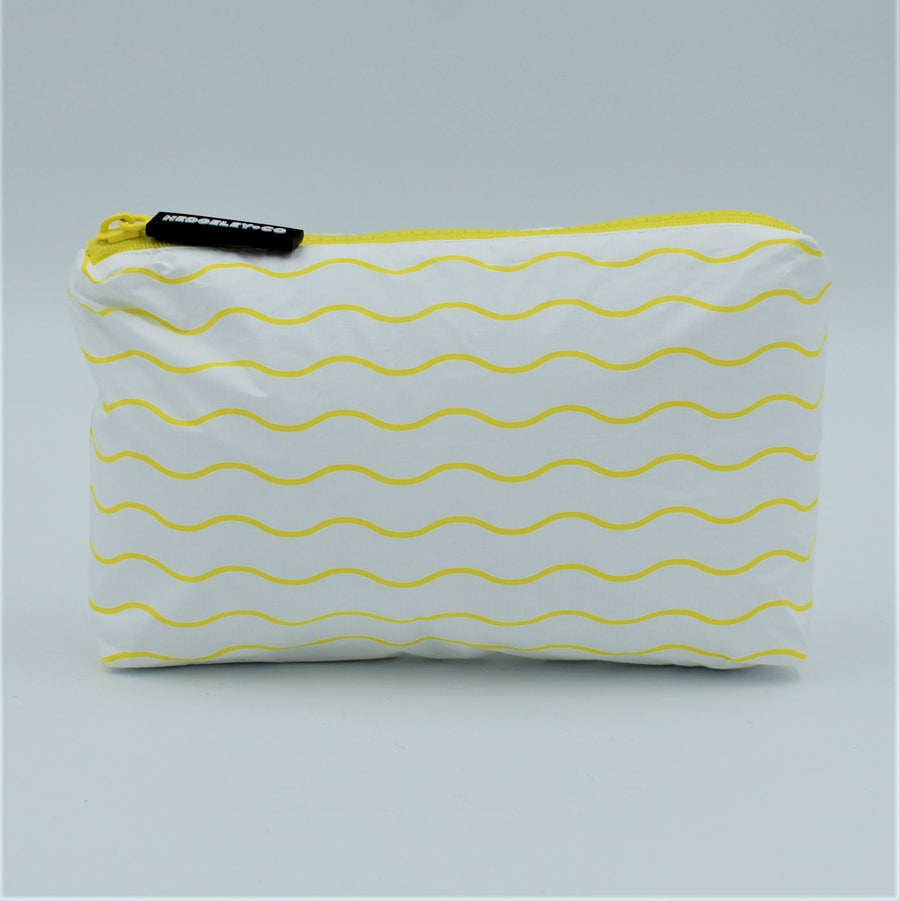 Mini zip pouch in Waving pattern in yellow and white.