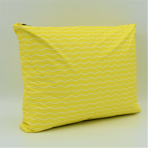 Side view of Large zip pouch in Waving pattern in yellow and white.